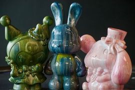 Colorful fluid-art bunny sculptures made at Mudbug Art.