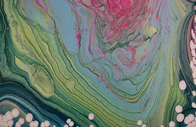 A richly marbled fluid-art surface in earthy green, cream, and plum tones