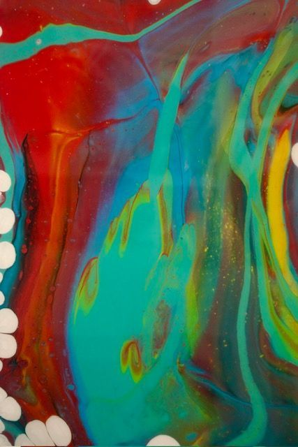 A finished colorful art piece displayed at Mudbug Art